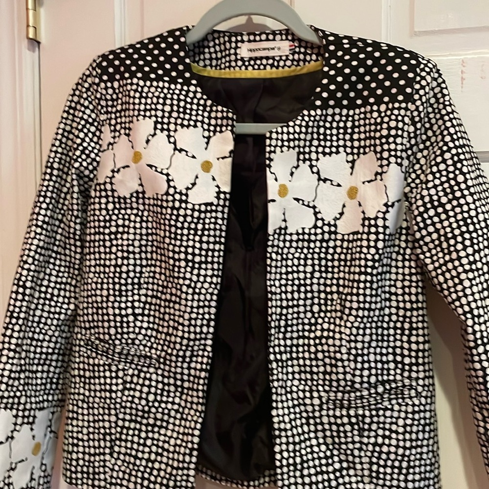 A decor jacket that is floral and business attire